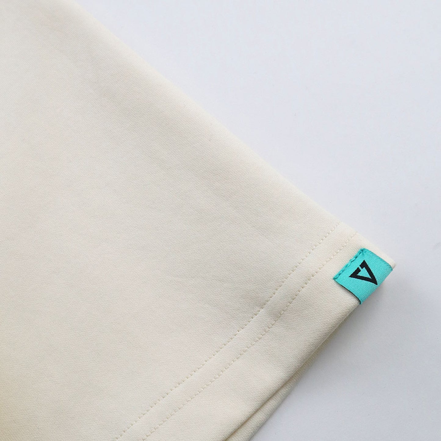 EGLAF | Sculpta Triangle Emblem Tee Cream White